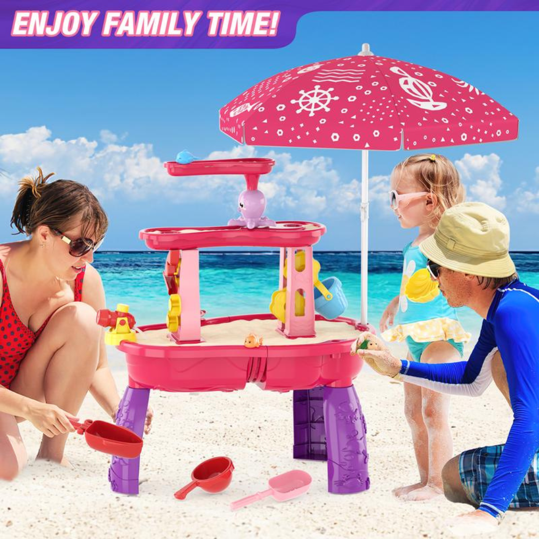 Family playing around sand and water table