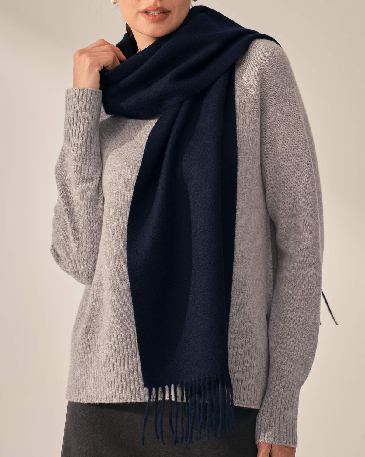 Navy cashmere scarf styled with grey knitwear